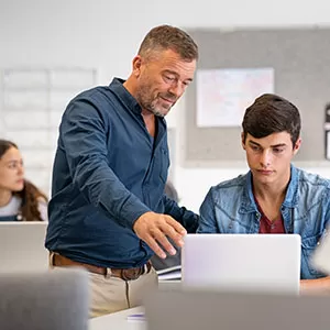 Student reading book in library wearing mask