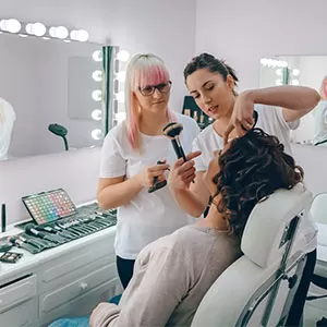 Student reading book in library wearing mask